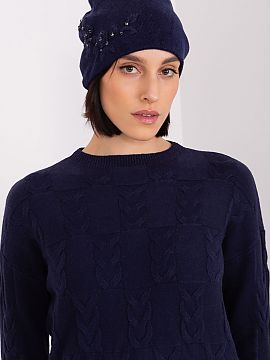 Cap AT  Warm women\'s winter hat made of smooth knit fabric with decorative applique on the side.