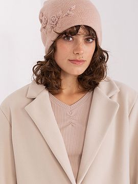 Cap AT  Warm women\'s winter hat made of smooth knit fabric with decorative applique on the side.