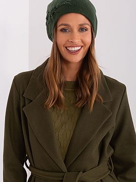 Cap AT  Warm winter women\'s cap made of smooth knit fabric with decorative applique on the side.