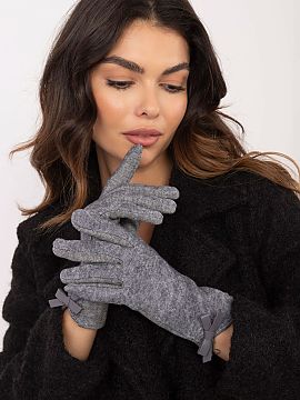 Gloves AT  Elegant women\'s gloves made of warm material in an interesting pattern. Decorative bows at the wrists. The index finger with an embroidered