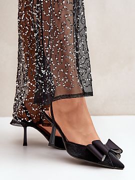 High heels Step in style  Elegant women\'s high heels made of textile material. The front of the shoes is decorated with a fancy bow that catches the eye and gives th