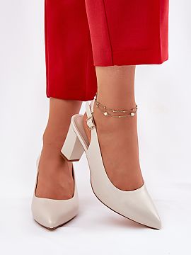 Block heel pumps Step in style  Comfortable pumps set on a stable column heel. They have a strap around the ankle with an adjustable buckle. The model has a pointed toe and