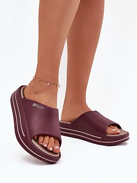 Flip-flops Step in style  Women\'s flip-flops from the Big Star brand made of soft and pleasant to the touch foam. The high sole adds a few centimeters of height, mak