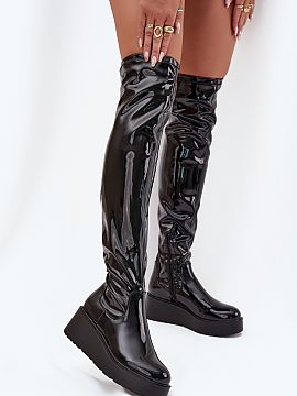Thigh-Hight Boots Step in style  Women\'s boots made of patent leather eco leather are an elegant proposition for cooler days. Set on a massive platform and delicate wedge h