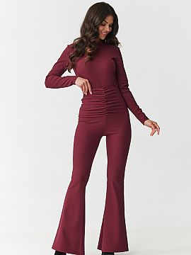 Complete Makadamia  Bet on a look that combines elegance and comfort! This unique women\'s set consists of a fitted blouse with long sleeves and high-waisted pa