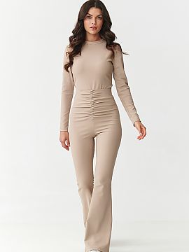 Complete Makadamia  Bet on a look that combines elegance and comfort! This unique women\'s set consists of a fitted blouse with long sleeves and high-waisted pa