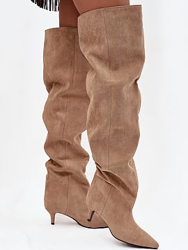 Heel boots Step in style  Women\'s boots made of eco suede. The model is set on a low heel. A characteristic feature of the shoes is the wide shaft, which not only gi
