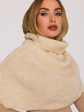 Chimney Moe  The enveloping chimney made of soft yarn with a loose weave that provides warmth and exceptional comfort when worn. The model with a high co