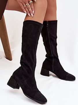 Heeled boots Step in style  Women\'s boots made of eco-suede are a proposal that combines classic with a touch of modern shine. The model is set on a stable block heel,