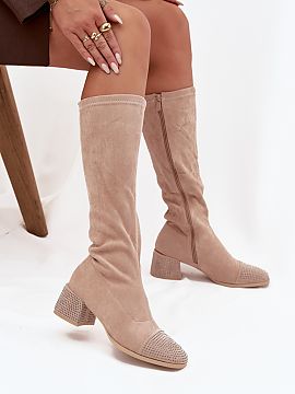 Heeled boots Step in style  Women\'s boots made of eco suede are a proposal that combines classic style with a touch of modern shine. The model is set on a stable block