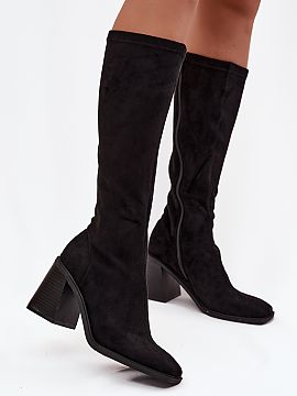 Heeled boots Step in style  Women\'s boots made of eco suede are a proposal that delights with elegance and universal style. The model fastened with a zipper is set on 