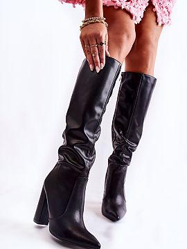 Heeled boots Step in style  Classic heeled boots made of eco leather. The shoes have a pointed toe. Zippered along the entire length of the shaft. They have a stiffened