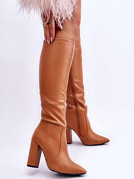 Heeled boots Step in style  Classic heeled boots made of faux leather. The shoes have a pointed toe. Closed with a zipper along the entire height of the shaft. They hav
