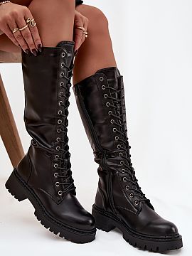 Kozaki Step in style  Women\'s combat boots made of eco leather. The model stands out with a stylish look that fits perfectly with current trends. The shoes are f
