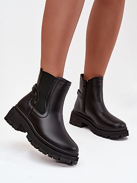 Slippers Step in style  Women\'s ankle boots in the style of riding boots, made of eco leather, are a timeless proposition for colder days. The model, set on a stab