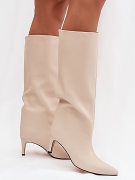 Heeled boots Step in style  Women\'s boots made of eco leather are an elegant proposal for colder days. Slipped on and set on a slender stiletto, they add lightness and