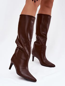 Heeled boots Step in style  Women\'s vegan leather boots are an elegant proposition for colder days. Slip-on and set on a slender heel, they add lightness and feminine 