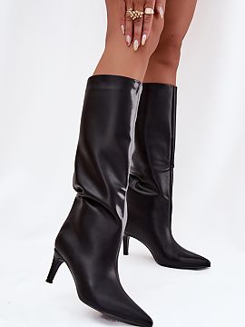 Heeled boots Step in style  Women\'s boots made of eco leather are an elegant proposition for colder days. Slipped on and set on a slim heel, they add lightness and fem
