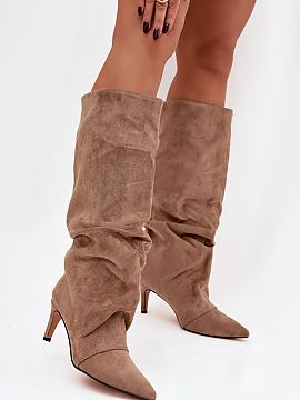 Heeled boots Step in style  Women\'s boots made of soft eco suede are an elegant and feminine proposition for colder days. The model on a slim stiletto beautifully emph