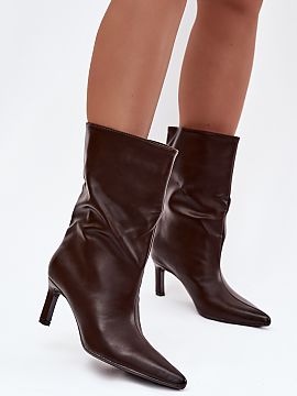 Heeled boots Step in style  These slip-on boots are a real bullseye if you are looking for something stylish and feminine! The slender heel adds lightness and subtly el