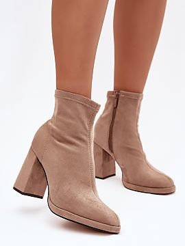 Heeled boots Step in style  Women\'s ankle boots made of eco-suede are a stylish model perfect for cooler days. Set on a stable column heel, they gently emphasize the s