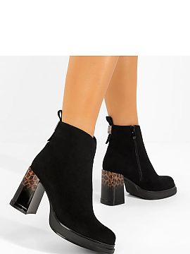 Heeled boots Solea  Discover elegance and style with black ankle boots with a panther-patterned heel from the renowned brand Gemre. These unique heeled ankle bo