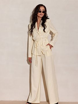 Long sleeve shirt Roco Fashion  The elegant blouse with a design inspired by a blazer stands out with a delicate tie at the waist, subtle button closure, and vertical strip