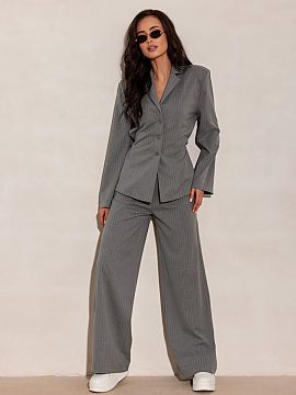 Long sleeve shirt Roco Fashion  The elegant blouse inspired by a jacket stands out with a delicate waist tie, subtle button fastening, and vertical stripes that visually sl