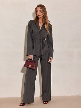 Long sleeve shirt Roco Fashion  The elegant blouse with a silhouette inspired by a blazer stands out with a delicate tie at the waist, subtle button fastening, and vertical