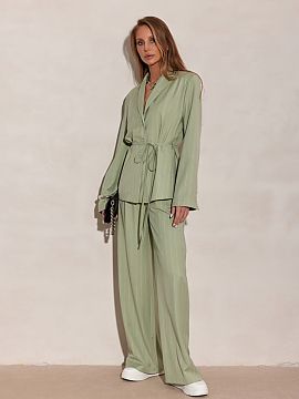 Long sleeve shirt Roco Fashion  The elegant blouse with a cut inspired by a blazer stands out with a delicate tie at the waist, subtle button fastening, and vertical stripe