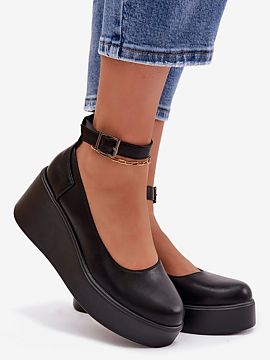 Heeled boots Step in style  Ladies\' shoes made of eco-leather. The model set on a wedge heel ensures comfort and delicately emphasizes the silhouette. The ankle strap 