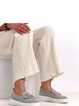 Sneakers Solea  Modern sneakers with an eye-catching decorative buckle on the front are a stylish proposition for people who appreciate comfort and original