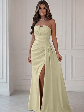 Long dress Bicotone  Dazzling evening dress in a yellow shade, made of subtly shimmering fabric fastened with a hidden zipper. The modern corset with eye-catchin