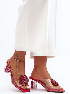 Heeled sandals Step in style  Transparent high-heeled sandals by S.Barski. The shoes are set on a decorated with sequins heel. At the front, there is a jewelry decoration
