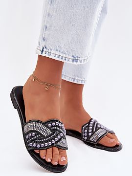 Slippers Step in style  Stylish flat women\'s flip-flops are an eye-catching proposal for summer. The strap adorned with crystals, zircons, and beads catches the ey
