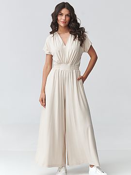 Suit Makadamia  Modern women\'s jumpsuit with wide legs is a perfect choice for women who appreciate style and comfort in one. The loose, flowing cut beauti