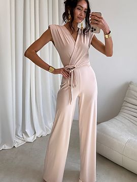 Suit Roco Fashion  Elegant jumpsuit with a fitted cut perfectly accentuates the silhouette. The wrap neckline and waist tie give it a subtle, feminine characte