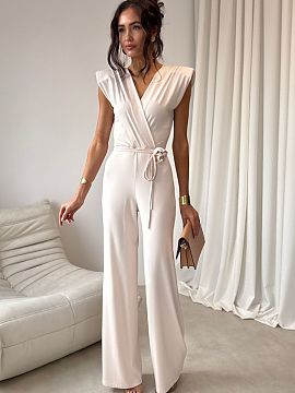 Suit Roco Fashion  The elegant jumpsuit with a fitted cut perfectly accentuates the silhouette. The shawl collar and tie at the waist give it a subtle, feminin