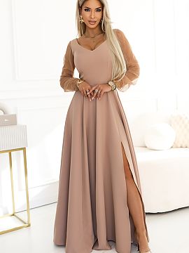 Long gown Numoco  Meet the Loretta dress, which makes an impression before the first note sounds. The warm, noble shade of beige envelops the figure with calm
