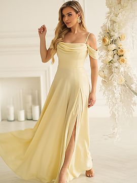 Long gown Bicotone  The fitted top emphasizes the waist, while the long, flowing skirt visually slims the silhouette. The eye-catching slit adds lightness and f