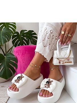 Platform sandals Solea  Stylish slippers with a decorative bow are the perfect combination of comfort and a fashionable look. Made of durable plastic material, they