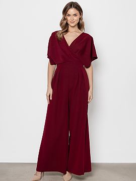 Suit awama  Elegant jumpsuit with a modern cut that combines comfort with refined style. The top has a wrap neckline that subtly accentuates the silhoue