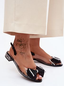 Sandals Step in style  Transparent women\'s sandals are an elegant and eye-catching proposal for special occasions. At the front, there is a mesh bow that serves a