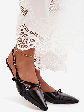 Sandals Step in style  Women\'s sandals made of imitation leather are a stylish option for women who appreciate trendy designs and an eye-catching appearance. The 