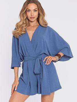 Suit Moe  An elegant women\'s jumpsuit made of a light fabric with a distinct texture (crepe) and a matte finish is a proposal that combines modern st