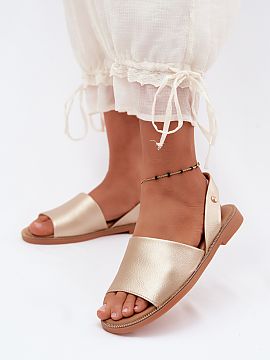 Sandals Step in style  Women\'s sandals made of eco-leather are an elegant proposal for warm days. Set on a flat heel, they provide comfort and convenience through