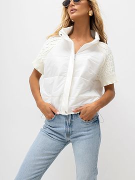Gilet Italy Moda  Quilted women\'s vest with knitted sleeves is a stylish proposal in a casual edition, perfect for everyday, autumn and transitional stylizat