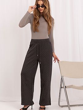 Tracksuit trousers Italy Moda  Women\'s wide leg sweatpants are an eye-catching proposal that combines the comfort of a sporty cut with a fashionable, distinctive finish. 