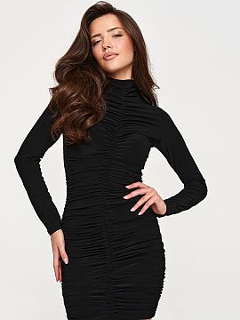 Evening dress Makadamia  Fitted dress made of elastic material that fits well on the silhouette and ensures comfort while wearing. The model has long sleeves and str