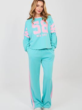 Set Rue Paris  Women\'s tracksuit set consisting of a sweatshirt and pants is a comfortable and stylish option for everyday casual styling. The model is pe